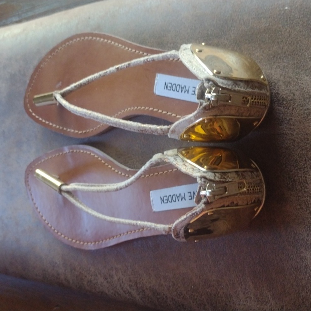 A pair of Steve Madden Reader Gold Snake Sandals size 8 1/2
